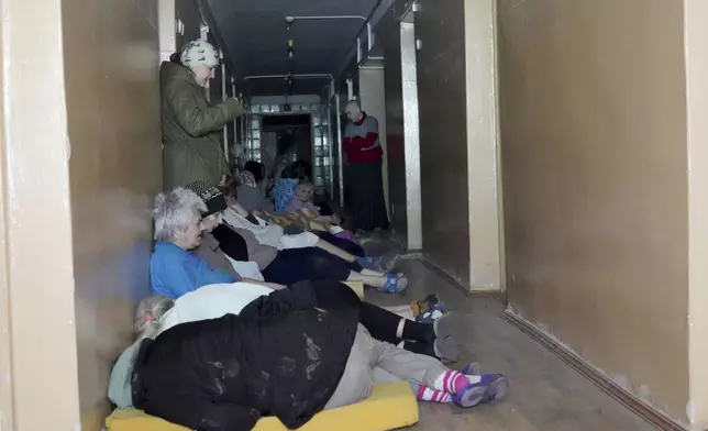 Patients take cover after a Russian attack on mental hospital №3 in Kharkiv, Ukraine, Saturday, April 27, 2024. (AP Photo/Andrii Marienko)