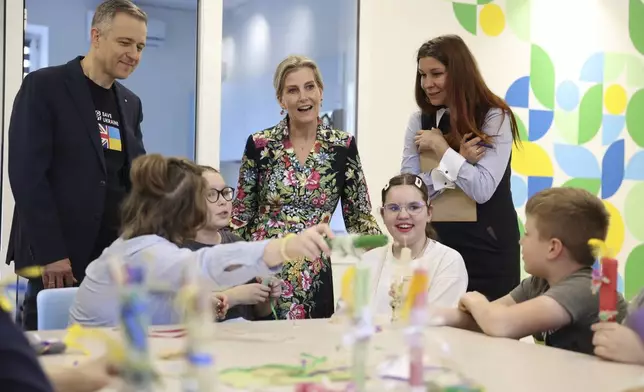 Britain's Sophie, Duchess of Edinburgh, meets with children as she visits the Family center of the NGO "Save Ukraine" in the town of Irpin, Ukraine, Monday, April 29, 2024. (Anatolii Stepanov/Pool via AP)