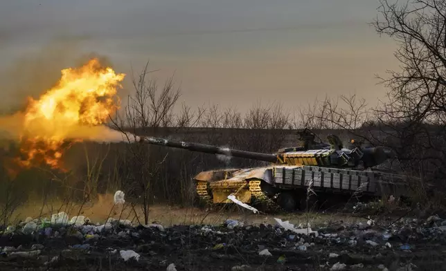FILE - A Ukrainian tank of the 17th Tank Brigade fires at Russian positions in Chasiv Yar, the site of fierce battles with the Russian troops in the Donetsk region, Ukraine, Thursday, Feb. 29, 2024. (AP Photo/Efrem Lukatsky, File)