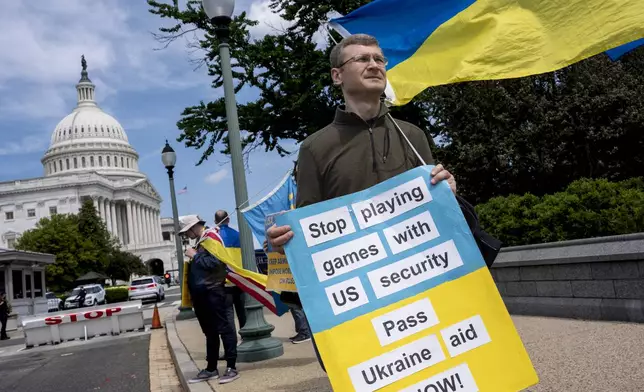 FILE - Activists supporting Ukraine demonstrate outside the Capitol in Washington, Saturday, April 20, 2024, as the House prepares to vote on approval of $95 billion in foreign aid for Ukraine, Israel and other U.S. allies. (AP Photo/J. Scott Applewhite, File)