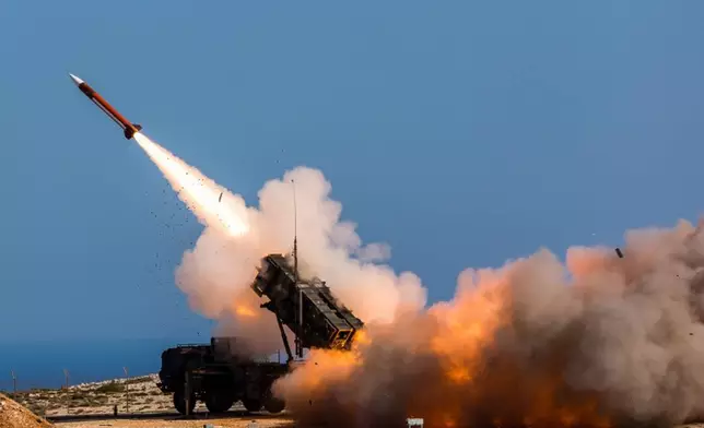 FILE - In this image released by the U.S. Department of Defense, German soldiers assigned to Surface Air and Missile Defense Wing 1, fire the Patriot weapons system at the NATO Missile Firing Installation, in Chania, Greece, on Nov. 8, 2017. U.S. officials say the Pentagon is expected to announce that it will provide about $6 billion in long-term military aid to Ukraine. It will include much sought after munitions for Patriot air defense systems and other weapons. (Sebastian Apel/U.S. Department of Defense, via AP, File)