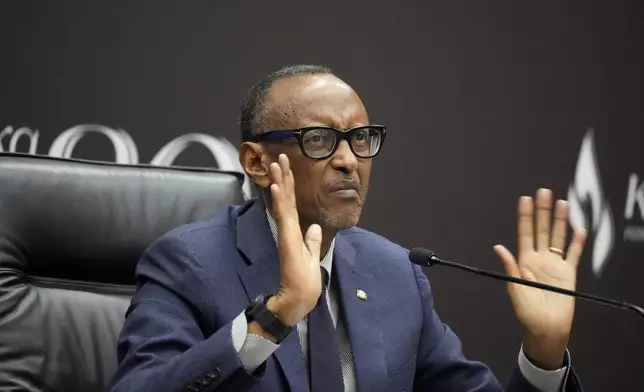 Rwanda's President Paul Kagame gestures as he gives a press conference at Kigali Convention Centre in Kigali, Rwanda, Monday, April 8, 2024. Rwandans are commemorating 30 years since the genocide in which an estimated 800,000 people were killed by government-backed extremists, shattering this small east African country that continues to grapple with the horrific legacy of the massacres. (AP Photo/Brian Inganga)