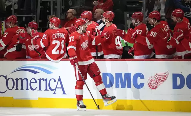 Detroit Red Wings center Dylan Larkin (71) celebrates his goal against the Buffalo Sabres in the first period of an NHL hockey game Sunday, April 7, 2024, in Detroit. (AP Photo/Paul Sancya)