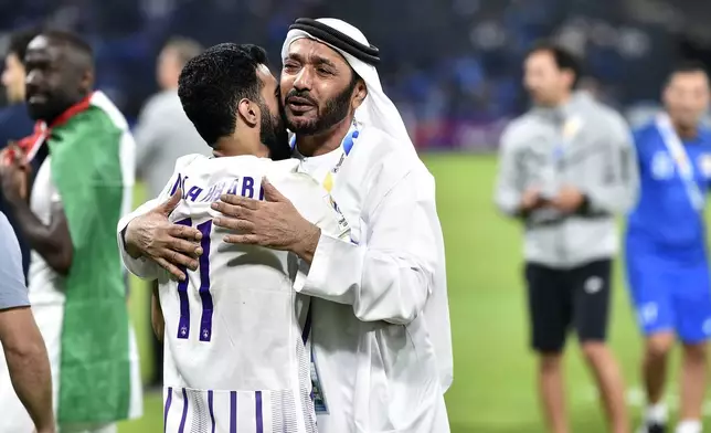 UAE's Al Ain' player Bandar Al Ahbabi, left, celebrates after the second leg of their AFC Champions League 2023/24 semi-final match against Saudi Arabia's Al Hilal at Kingdom Arena Stadium in Riyadh, Saudi Arabia,Tuesday, April 23, 2024. (AP Photo)