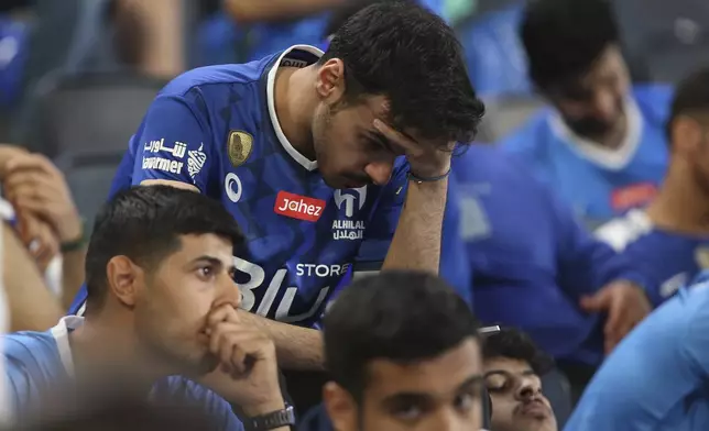 Saudi Arabia's Al Hilal fans react during a second leg of the AFC Champions League 2023/24 semi-final match against UAE's Al Ain at Kingdom Arena Stadium in Riyadh, Saudi Arabia,Tuesday, April 23, 2024. (AP Photo)