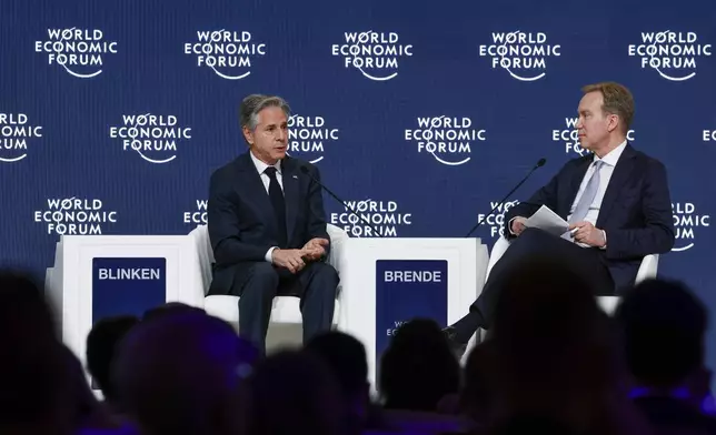 U.S. Secretary of State Antony Blinken, left, speaks WEF's President Borg Brende during the World Economic Forum (WEF) in Riyadh, Saudi Arabia, Monday April 29, 2024. (Evelyn Hockstein/Pool via AP)