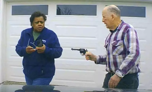 In this image taken from Uber dashcam video released by the Clark County, Ohio, Sheriff's Office, William Brock, right, holds a weapon to Uber driver Loletha Hall outside his home in South Charleston, Ohio, on March 25, 2024. Brock, 81, who authorities say fatally shot Hall who he thought was trying to rob him after scam phone calls deceived them both, was indicted on a murder charge, Monday, April 15, 2024, by a Clark County grand jury. Hall had no knowledge of the calls made to Brock, authorities said. (Clark County Sheriff's Office via AP)