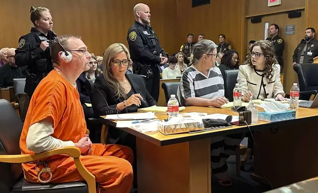 From left, James Crumbley, defense lawyer Mariell Lehman, Jennifer Crumbley, and defense lawyer Shannon Smith await sentencing in Oakland County, Mich., court on Tuesday, April 9, 2024. The Crumbleys were convicted of involuntary manslaughter for a school shooting committed by their son in 2021. (AP Photo/Ed White)