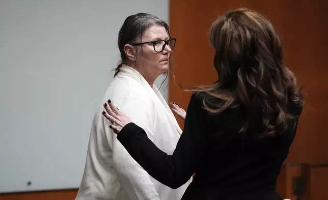 FILE - Jennifer Crumbley, left, looks to attorney Shanon Smith, Feb. 5, 2024, in Pontiac, Mich. (AP Photo/Carlos Osorio, Pool, File)