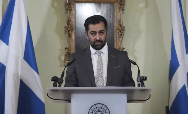 Scotland's First Minister Humza Yousaf pauses as he speaks during a press conference at Bute House, his official residence in Edinburgh, Monday April 29, 2024. Scotland’s first minister, Humza Yousaf, has resigned rather than face a no-confidence vote just days after he torpedoed a coalition with the Green Party by ditching a target for fighting climate change. (Andrew Milligan/PA via AP)