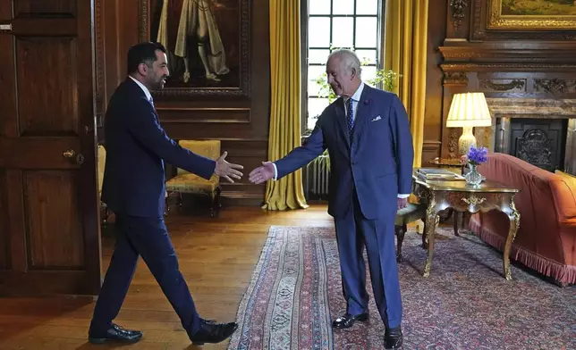 FILE - Britain's King Charles III, right, receives Scotland's First Minister Humza Yousaf during an audience at the Palace of Holyroodhouse in Edinburgh, Tuesday, July 4, 2023, part of the first Holyrood Week since his coronation. Scotland’s first minister, Humza Yousaf, has resigned on Monday, April 29, 2024, rather than face a no-confidence vote just days after he torpedoed a coalition with the Green Party by ditching a target for fighting climate change.(Andrew Milligan/Pool Photo via AP, File)