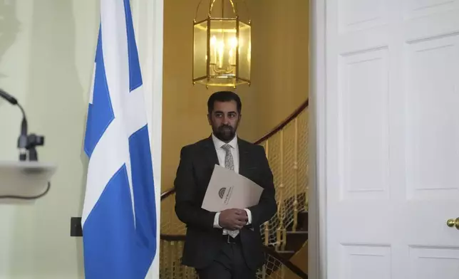 Scotland's First Minister Humza Yousaf arrives for a press conference at Bute House, his official residence in Edinburgh, Monday April 29, 2024. Scotland’s first minister, Humza Yousaf, has resigned rather than face a no-confidence vote just days after he torpedoed a coalition with the Green Party by ditching a target for fighting climate change. (Andrew Milligan/PA via AP)