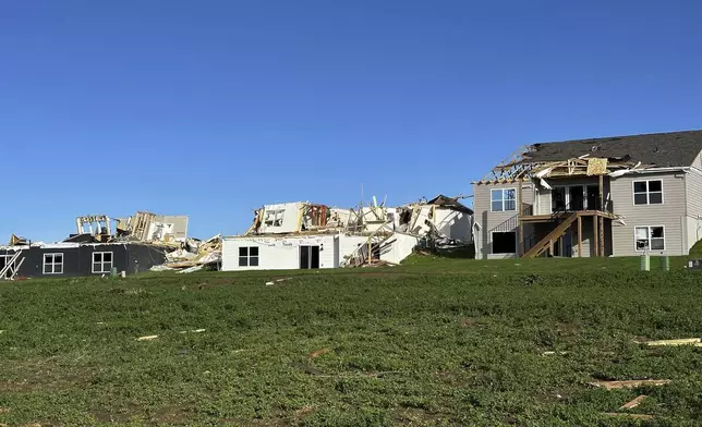Debris surround destroyed and damaged homes in Elkhorn, Neb., on Saturday, April 27, 2024. Residents began sifting through the rubble after a tornado plowed through suburban Omaha, demolishing homes and businesses as it moved for miles through farmland and into subdivisions. (AP Photo/Nicholas Ingram)