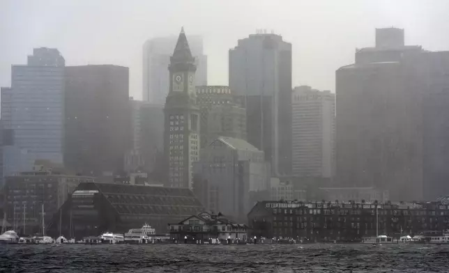 Rain and strong wind sweep across the harbor during a spring storm, Thursday, April 4, 2024, in Boston. (AP Photo/Michael Dwyer)