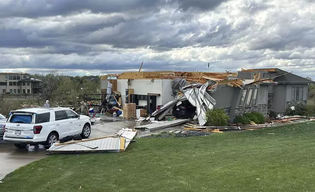 Damage is seen to a home after a tornado passed through the area near Bennington, Neb., Friday, April 26, 2024. (AP Photo/Josh Funk)