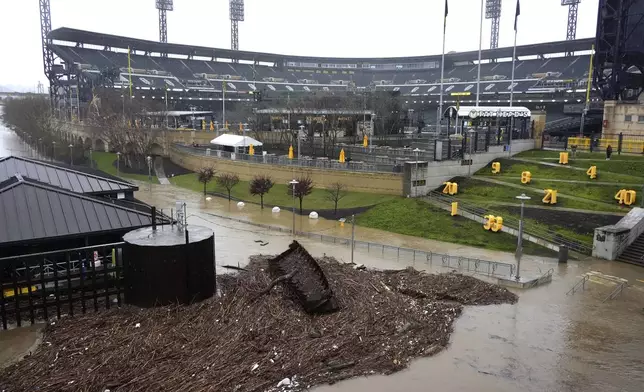 The Northshore riverwalk outside PNC Park in Pittsburgh is flooded by the overflowing Allegheny River Wednesday, April 3, 2024. (AP Photo/Gene J. Puskar)
