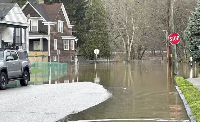 The Ohio River floods its banks on Wheeling Island, Thursday, April 4, 2024, in Wheeling, W.Va., following days of heavy rains in the region. (John McCabe/The Intelligencer via AP)