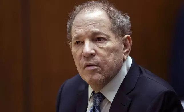 FILE - Former film producer Harvey Weinstein appears in court in Los Angeles, Oct. 4 2022. New York’s highest court has overturned Weinstein’s 2020 rape conviction and ordered a new trial. The Court of Appeals ruled Thursday, April 25, 2024 that the judge at the landmark #MeToo trial prejudiced him with improper rulings, including a decision to let women testify about allegations that weren’t part of the case. (Etienne Laurent/Pool Photo via AP, File)