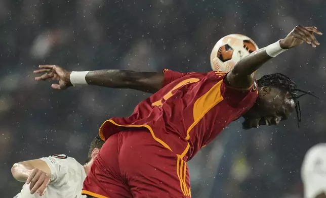 Roma's Tammy Abraham attempts to control the ball during the Europa League quarterfinal second leg soccer match between Roma and AC Milan at Rome's Olympic Stadium, Thursday, April 18, 2024. (Alfredo Falcone/LaPresse via AP)