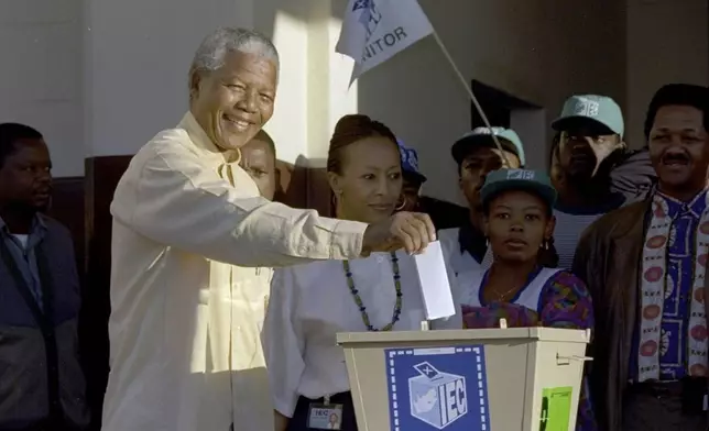 FILE - Then African National Congress leader, Nelson Mandela casts his vote April 27, 1994 near Durban, South Africa, in the country's first all-race elections. South Africans celebrate "Freedom Day" every April 27, when they remember their country's pivotal first democratic elections in 1994 that announced the official end of the racial segregation and oppression of apartheid. (AP Photo/John Parkin. File)