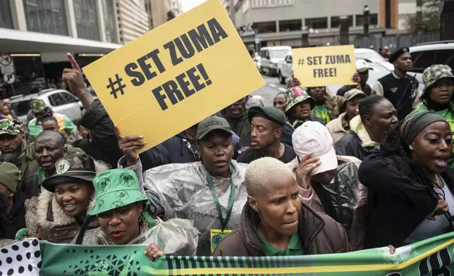 FILE — Supporters of former South African President Jacob Zuma and the UMkhonto WeSizwe (MK) party outside the Electoral High Court in Johannesburg Monday April 8 2024. For the first time since 1994, the ruling African National Congress (ANC) might receive less than 50% of votes after Zuma stepped down in disgrace in 2018 amid a swirl of corruption allegations and has given his support to the newly-formed political party. (AP Photo/File)