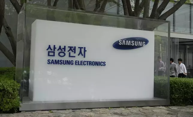 The logo of the Samsung Electronics Co. is seen at its office in Seoul, South Korea, Tuesday, April 30, 2024. Samsung Electronics on Tuesday reported a 10-fold increase in operating profit for the last quarter as the expansion of artificial intelligence technologies drives a rebound in the markets for computer memory chips.(AP Photo/Ahn Young-joon)