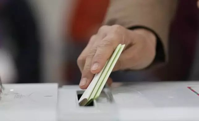 FILE - A voter casts their ballot for the parliamentary election at a local polling station in Seoul, South Korea, Wednesday, April 10, 2024. (AP Photo/Lee Jin-man, File)