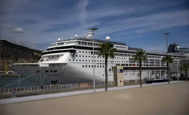 A view of the cruise ship MSC Armony moored in the port of Barcelona, Spain, Wednesday, April 3, 2024. Authorities said Wednesday that a group of 69 Bolivians are not being allowed to disembark from a cruise ship in the Spanish northeastern port of Barcelona because they lack valid documents to enter the European Union's Schengen area. (AP Photo/Emilio Morenatti)