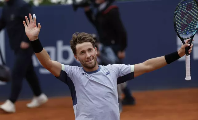 Casper Ruud of Norway celebrates after defeating Stefanos Tsitsipas of Greece 7-5, 6-3 during the final of the Barcelona Open tennis tournament in Barcelona, Spain, Sunday, April 21, 2024. (AP Photo/Joan Monfort)
