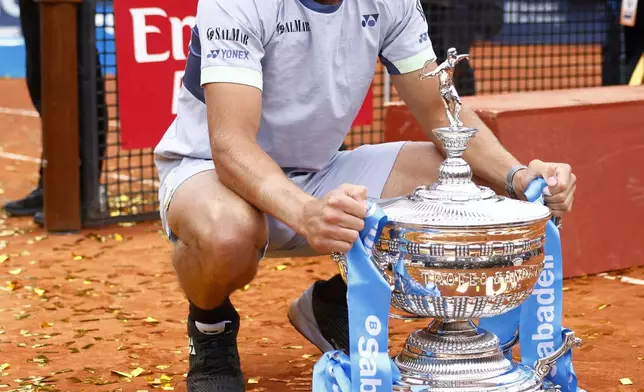 Casper Ruud of Norway poses with the trophy after defeating Stefanos Tsitsipas of Greece 7-5, 6-3 during the final of the Barcelona Open tennis tournament in Barcelona, Spain, Sunday, April 21, 2024. (AP Photo/Joan Monfort)