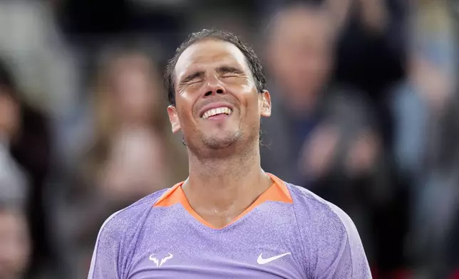 Rafael Nadal, of Spain, celebrates against Alex de Minaur, of Australia, during the Mutua Madrid Open tennis tournament in Madrid, Saturday, April 27, 2024. (AP Photo/Manu Fernandez)