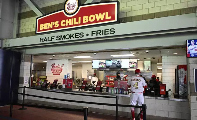 Ben's Chili Bowl stand at Nationals Park in Washington before an exhibition baseball game between the Washington Nationals and the Washington Nationals Futures, Tuesday, March 26, 2024. Most parks and arenas have a handful of areas that offer salads, gluten free or vegan offerings if fans are willing to hunt a little. But the vast majority of people attending baseball games aren't necessarily looking to eat healthy. (AP Photo/Nick Wass)