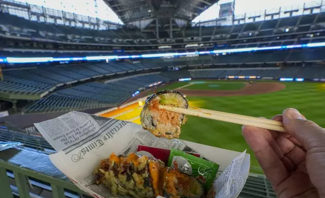 Some sushi is seen at American Family Field in Milwaukee during an event to show off some foods that fans can get at a game Thursday, March 28, 2024. Most parks and arenas have a handful of areas that offer salads, gluten free or vegan offerings if fans are willing to hunt a little. But the vast majority of people attending baseball games aren't necessarily looking to eat healthy. (AP Photo/Morry Gash)