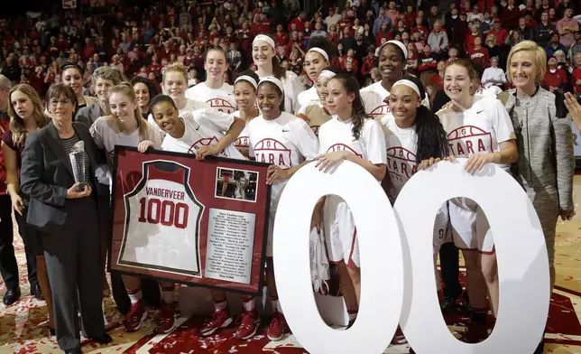 FILE - Stanford celebrates head coach Tara VanDerveer's, at left, 1,000th career coaching win after an NCAA college basketball game against Southern California Friday, Feb. 3, 2017, in Stanford, Calif. VanDerveer, the winningest basketball coach in NCAA history, announced her retirement Tuesday night, April 9, 2024, after 38 seasons leading the Stanford women’s team and 45 years overall. (AP Photo/Marcio Jose Sanchez, File)