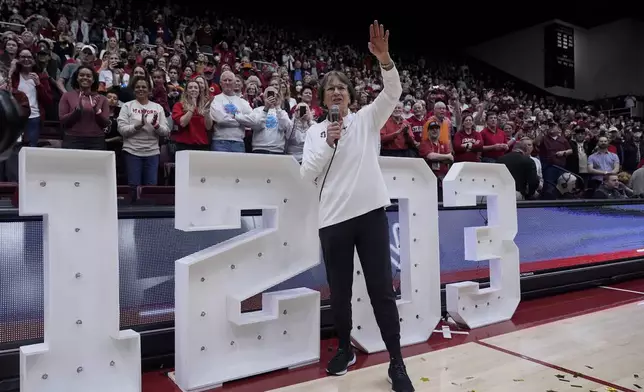 FILE - Stanford head coach Tara VanDerveer waves to the crowd after breaking the college basketball record for wins, 1,203, following her team's win over Oregon State in an NCAA college basketball game, Sunday, Jan. 21, 2024, in Stanford, Calif. VanDerveer, the winningest basketball coach in NCAA history, announced her retirement Tuesday night, April 9, 2024, after 38 seasons leading the Stanford women’s team and 45 years overall. (AP Photo/Godofredo A. Vásquez, File)