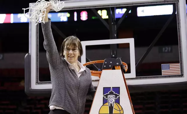 FILE - In this March 5, 2017, file photo, Stanford head coach Tara VanDerveer waves the net after finishing cutting it down after her team beat Oregon State in the Pac-12 Conference championship NCAA college basketball game in Seattle.. VanDerveer, the winningest basketball coach in NCAA history, announced her retirement Tuesday night, April 9, 2024, after 38 seasons leading the Stanford women’s team and 45 years overall. (AP Photo/Elaine Thompson, File)