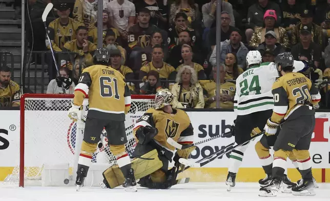 Vegas Golden Knights goaltender Logan Thompson (36) reacts after giving up a goal during overtime against the Dallas Stars in Game 3 of an NHL hockey Stanley Cup first-round playoff series Saturday, April 27, 2024, in Las Vegas. (AP Photo/Ian Maule)