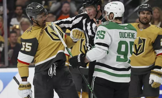 Linesman Ryan Daisy (81) breaks up a fight between Vegas Golden Knights right wing Keegan Kolesar (55) and Dallas Stars center Matt Duchene (95) during the second period in Game 3 of an NHL hockey Stanley Cup first-round playoff series Saturday, April 27, 2024, in Las Vegas. (AP Photo/Ian Maule)