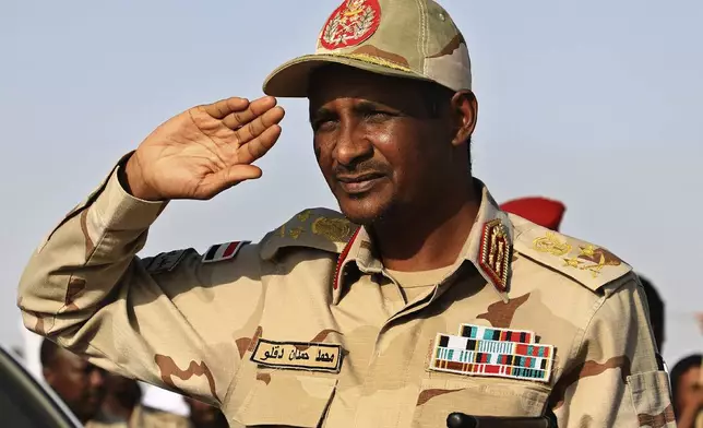 FILE - Gen. Mohammed Hamdan Dagalo, then deputy head of the military council, salutes during a rally, in Galawee, northern Sudan, June 15, 2019. Sudan has been torn by war for a year now, torn by fighting between the military and the notorious paramilitary Rapid Support Forces. (AP Photo, File)