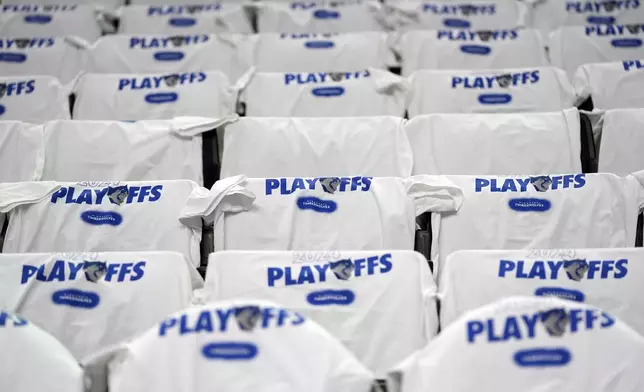 Shirts displayed on seats before Game 1 of an NBA basketball first-round playoff series between the Minnesota Timberwolves and Phoenix Suns, Saturday, April 20, 2024, in Minneapolis. (AP Photo/Abbie Parr)