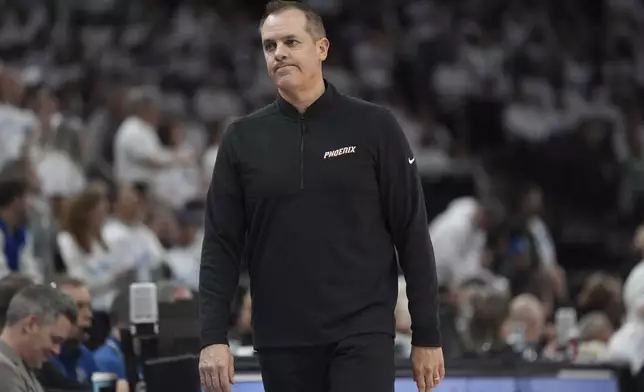 Phoenix Suns head coach Frank Vogel walks toward the bench during the first half of Game 1 of an NBA basketball first-round playoff series against the Minnesota Timberwolves, Saturday, April 20, 2024, in Minneapolis. (AP Photo/Abbie Parr)