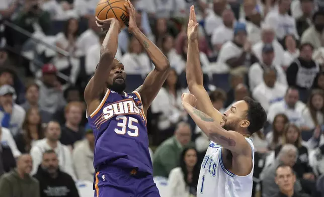 Phoenix Suns forward Kevin Durant (35) shoots over Minnesota Timberwolves forward Kyle Anderson (1) during the first half of Game 1 of an NBA basketball first-round playoff series, Saturday, April 20, 2024, in Minneapolis. (AP Photo/Abbie Parr)