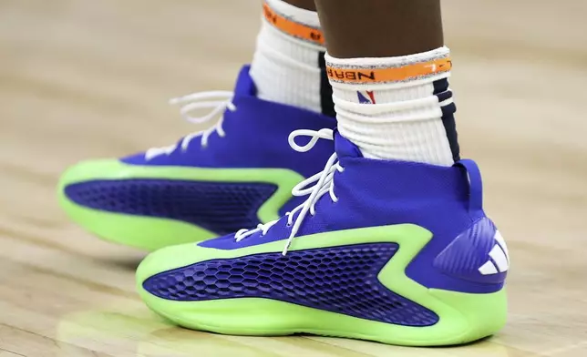 The shoes worn by Minnesota Timberwolves guard Anthony Edwards are seen during the second half of an NBA basketball game against the Phoenix Suns Sunday, April 14, 2024, in Minneapolis. (AP Photo/Matt Krohn)