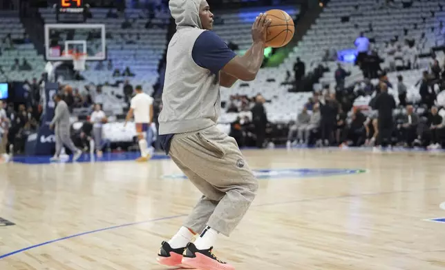 Minnesota Timberwolves guard Anthony Edwards warms up before Game 1 of an NBA basketball first-round playoff series against the Phoenix Suns, Saturday, April 20, 2024, in Minneapolis. (AP Photo/Abbie Parr)