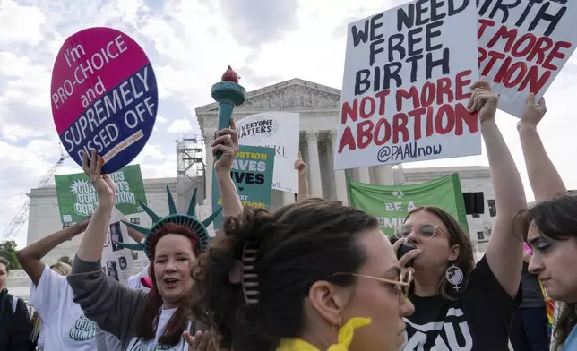 Anti-Abortion and Abortion-rights activists rally outside the Supreme Court, Wednesday, April 24, 2024, in Washington. (AP Photo/Jose Luis Magana)