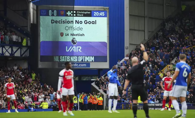 FILE - The display shows the VAR decision on a disallowed goal during the English Premier League soccer match between Everton and Arsenal at the Goodison Park stadium in Liverpool, England, Sept. 17, 2023. In England, according to figures given to rights-holder Sky Sports in February, 82% of refereeing decisions were deemed "correct" by the Premier League before VAR was adopted ahead of the 2019-20 season. Since VAR has been used, 96% of the decisions are correct, according to the league. (AP Photo/Jon Super, File)