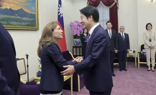 In this photo released by the Taiwan Presidential Office, Lisa McClain, left, secretary-general of the Republican Caucus of the U.S. House of Representatives meets with Taiwan President-elect and Vice President Lai Ching-te in Taipei, Taiwan on Tuesday, April 23, 2024. McClain and Democratic Congressman Dan Kildee jointly led a cross-party group of lawmakers to visit Taiwan from April 23 to 25 . Members also include Mark Alford, a member of the House Armed Services Committee. (Taiwan Presidential Office via AP)