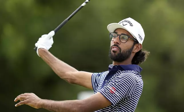 Akshay Bhatia watches his drive on the ninth hole during the final round of the Texas Open golf tournament, Sunday, April 7, 2024, in San Antonio. (AP Photo/Eric Gay)