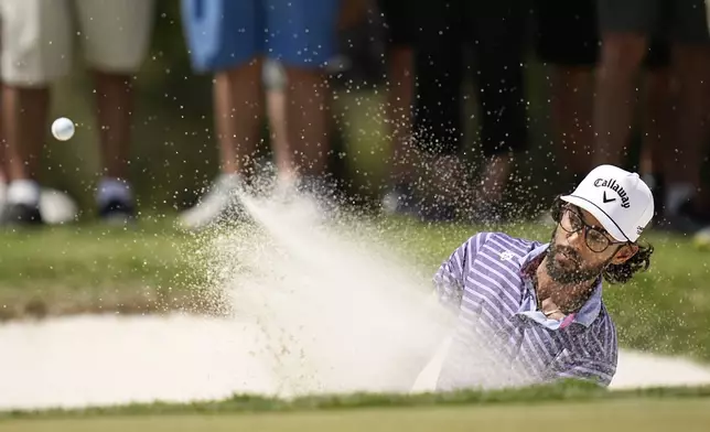 Akshay Bhatia hits out of a bunker on the eighth hole during the second round of the Texas Open golf tournament, Friday, April 5, 2024, in San Antonio. (AP Photo/Eric Gay)