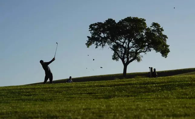 Jordan Spieth hits his approach shot on the 10th hole during the second round of the Texas Open golf tournament, Friday, April 5, 2024, in San Antonio. (AP Photo/Eric Gay)